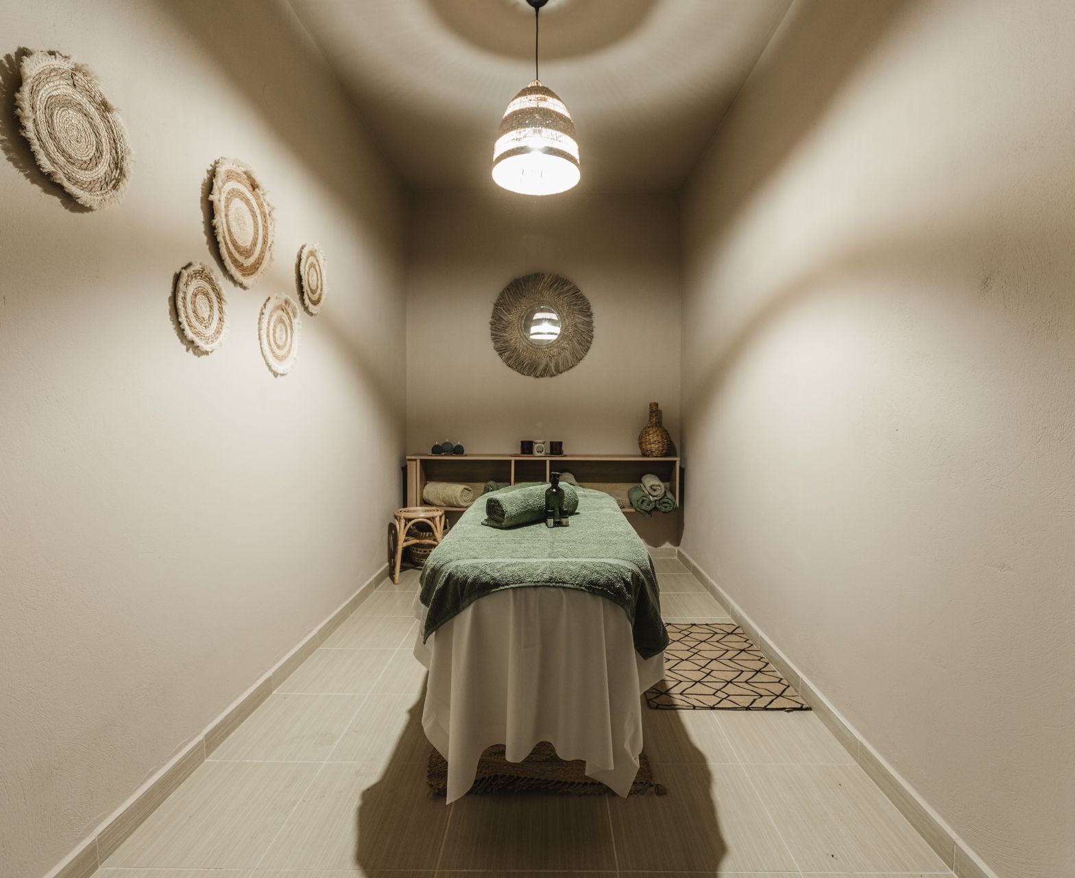 A small room with a massage table in it