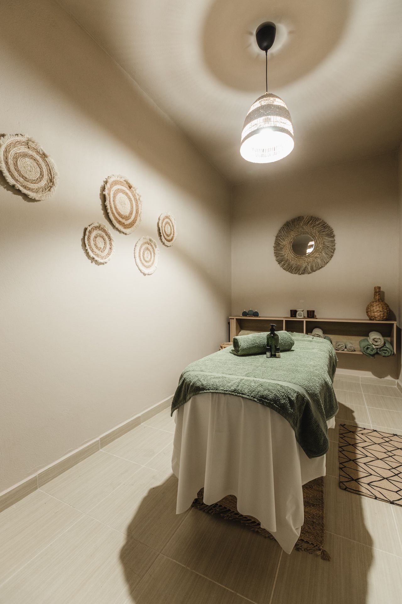 There is a massage table in the middle of the room.