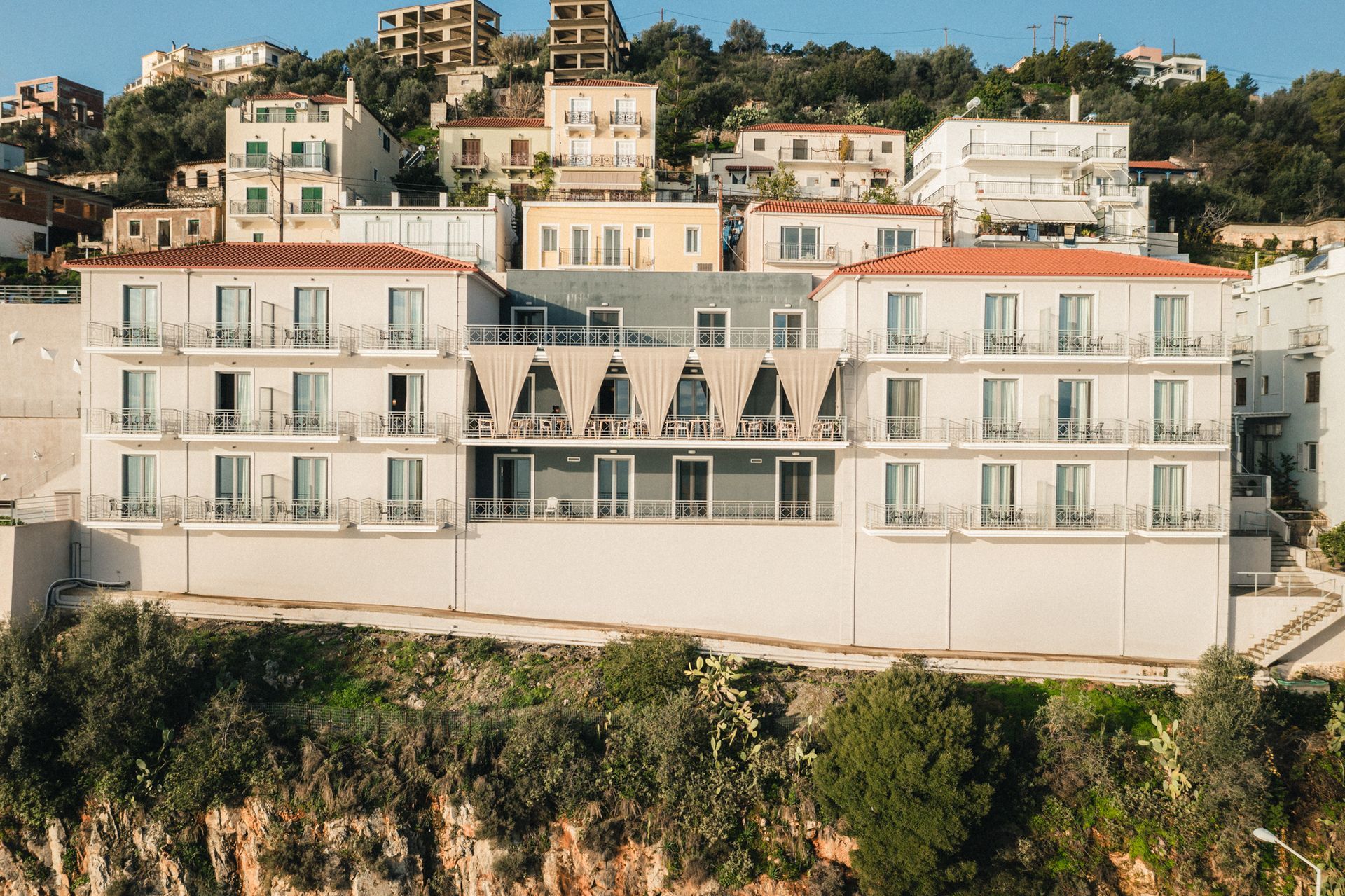 A large white building on top of a hill