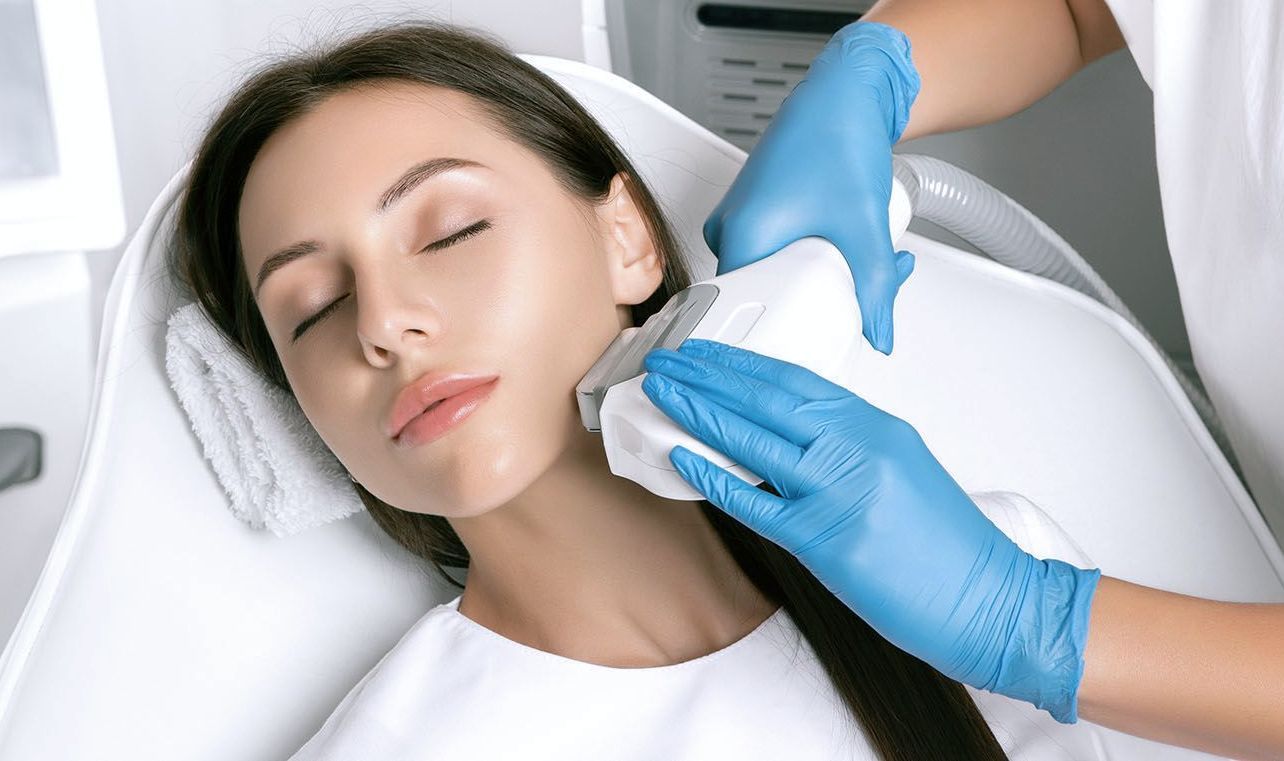 A man is getting a laser hair removal treatment on his chest.