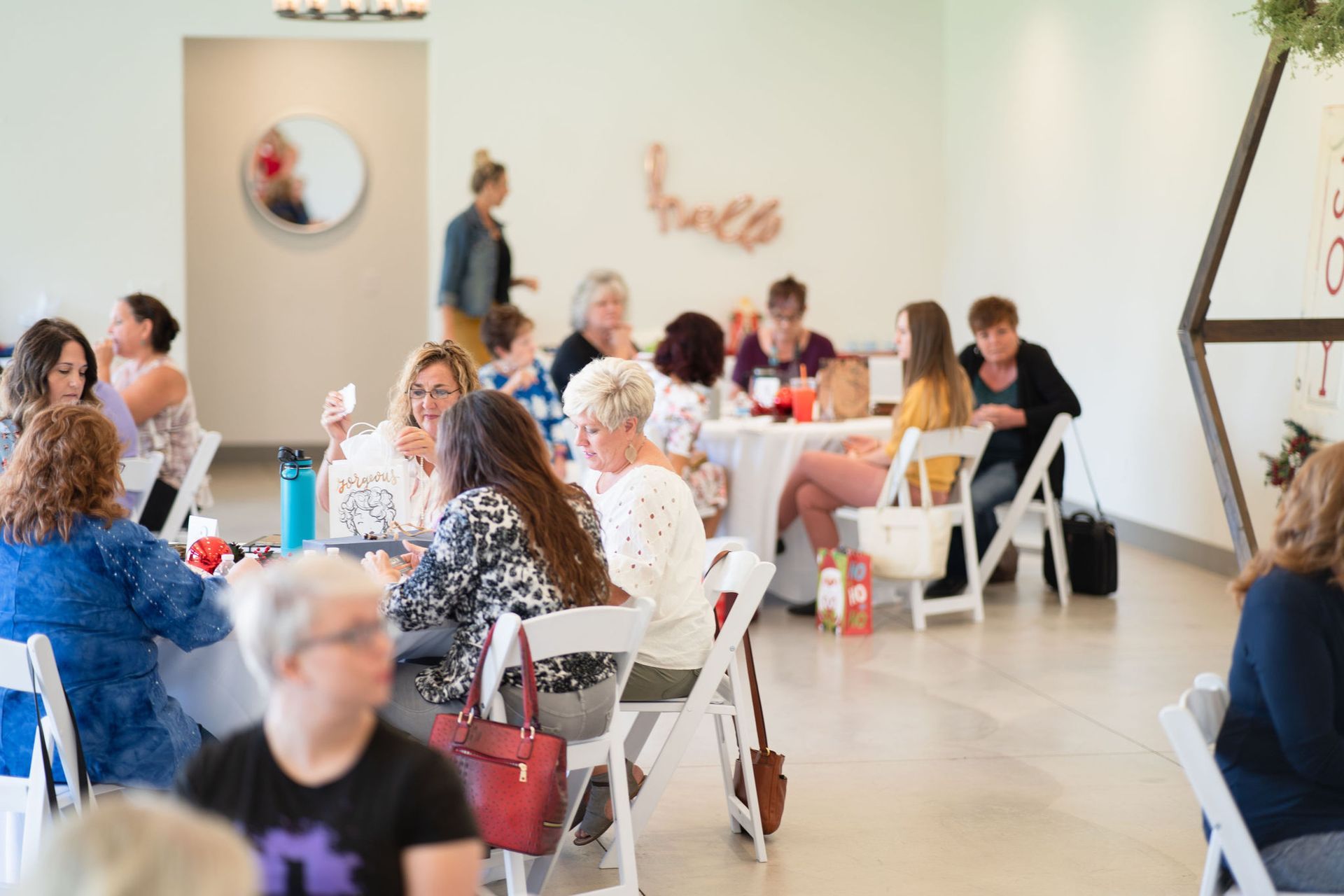A group of people are sitting around a conference table having a meeting.