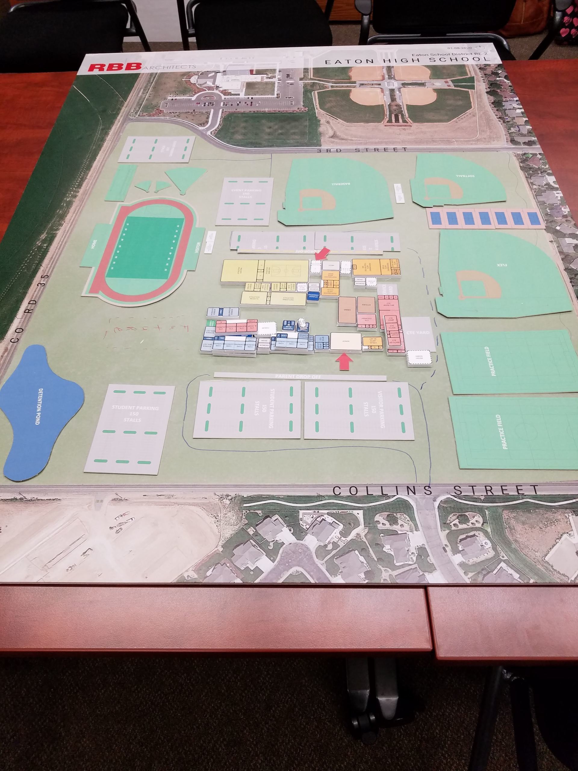 A large map of a park is on a table