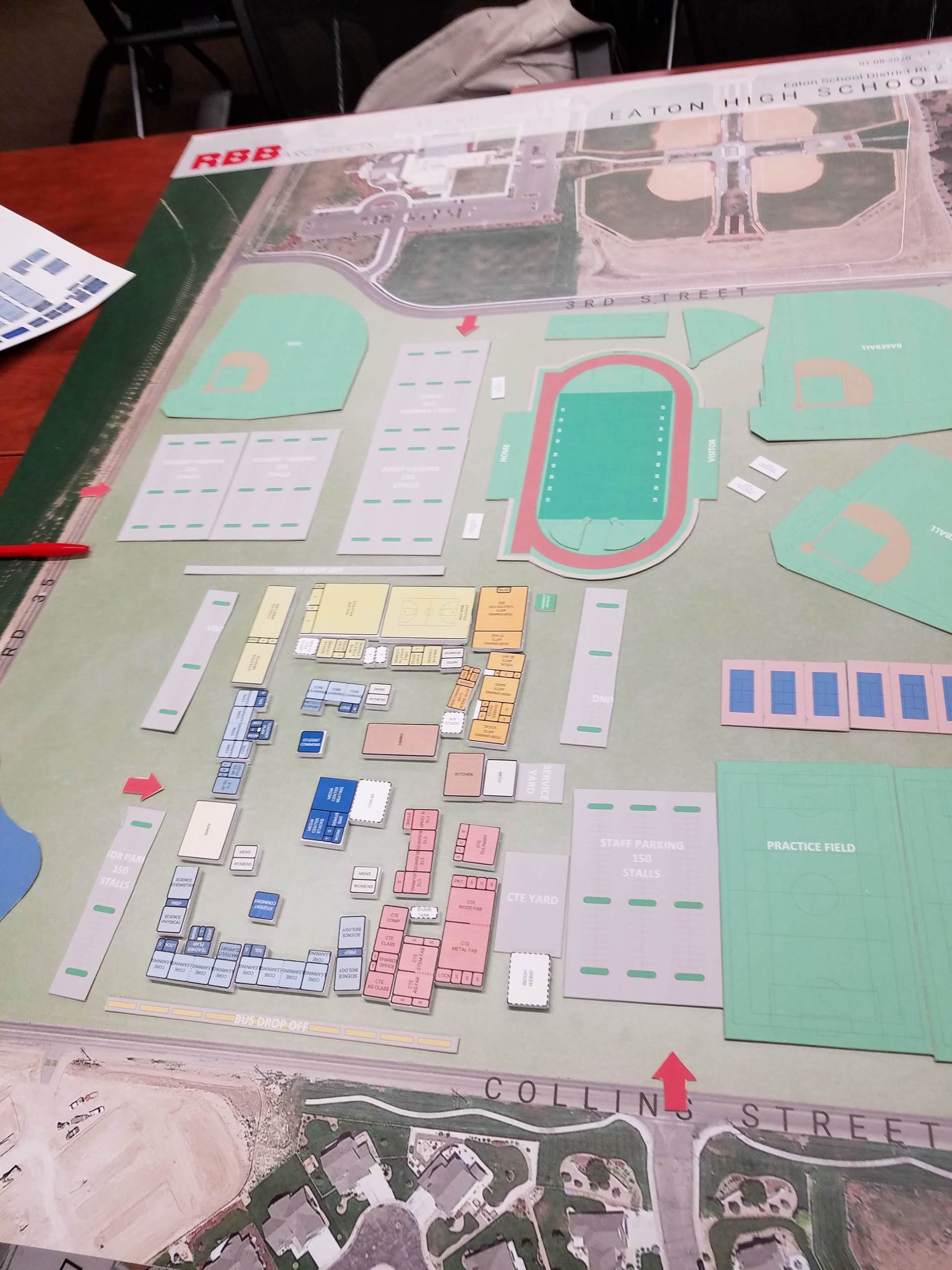 A map of a park with a red arrow pointing to a baseball field