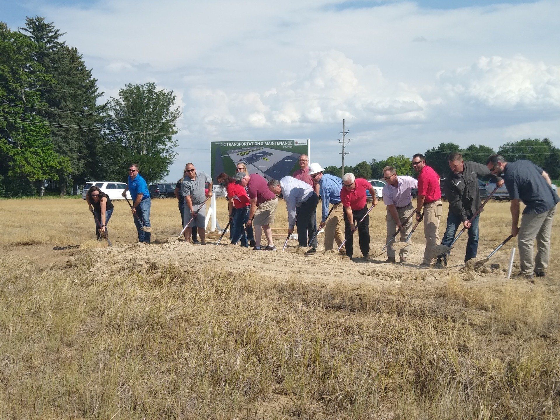 A group of people are digging in a field