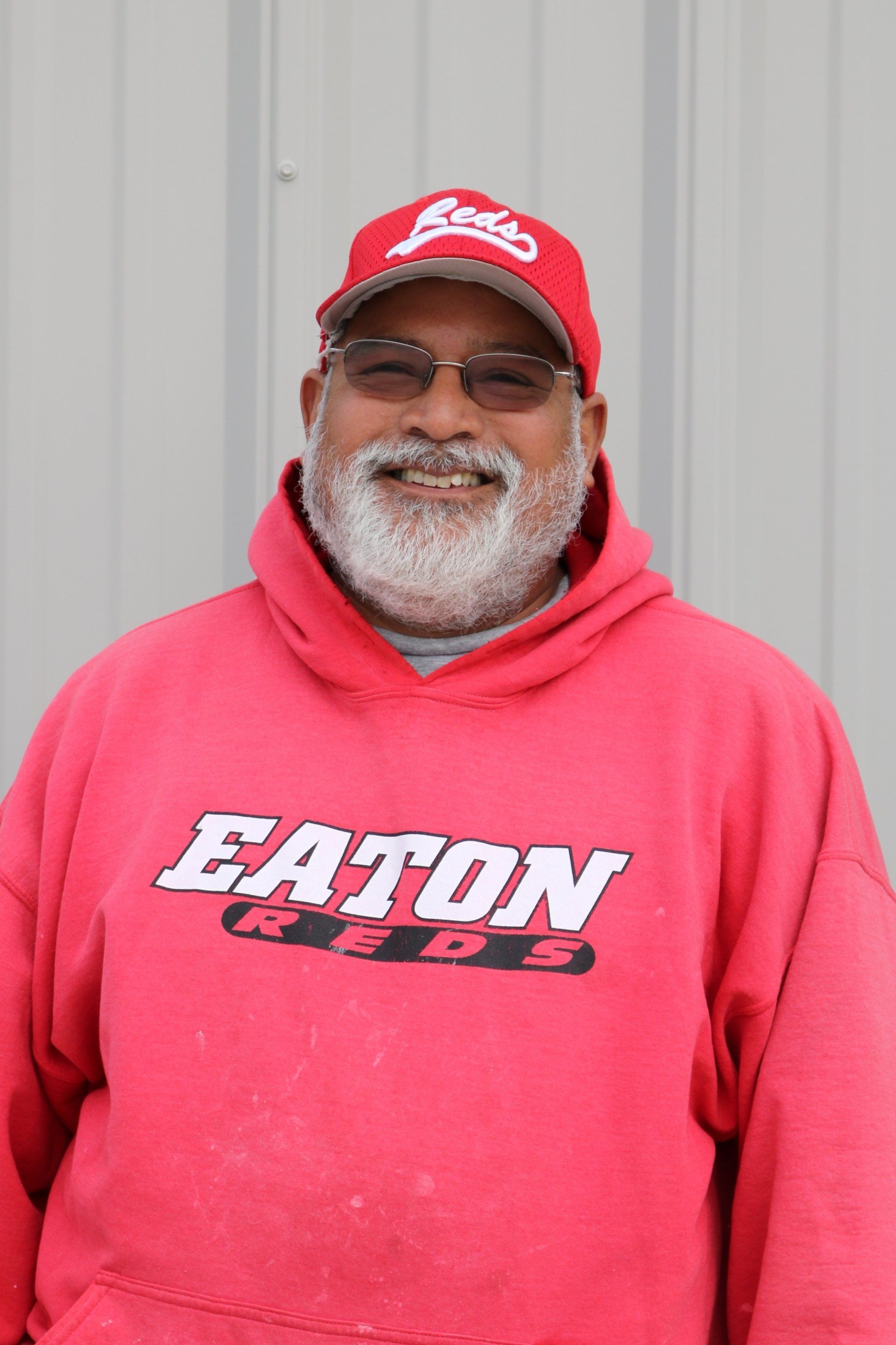 A man wearing a red eaton reds hoodie