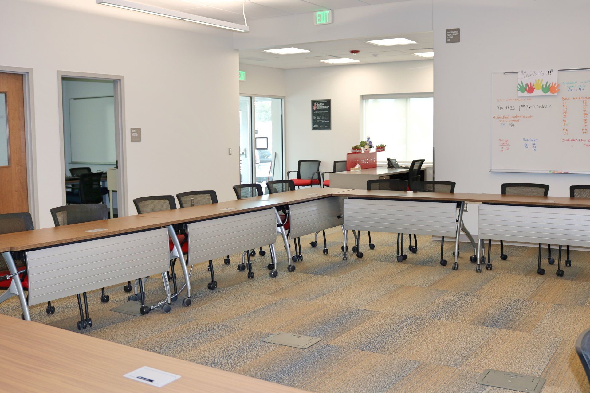 A large room with tables and chairs in it