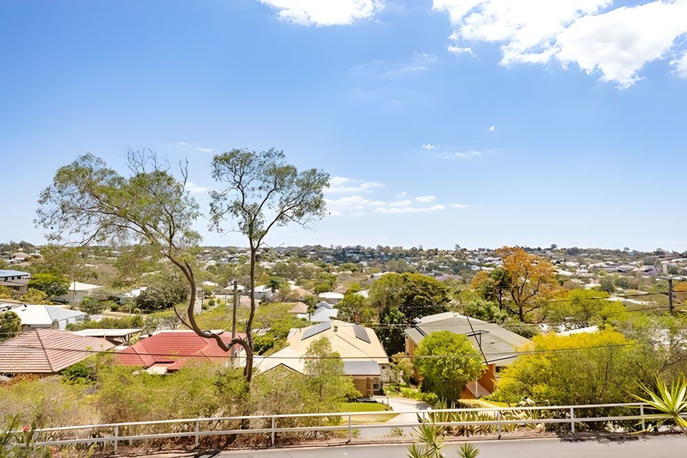 A View Of A Residential Area With Lots Of Houses And Trees — Munro Building Group In Stafford, QLD