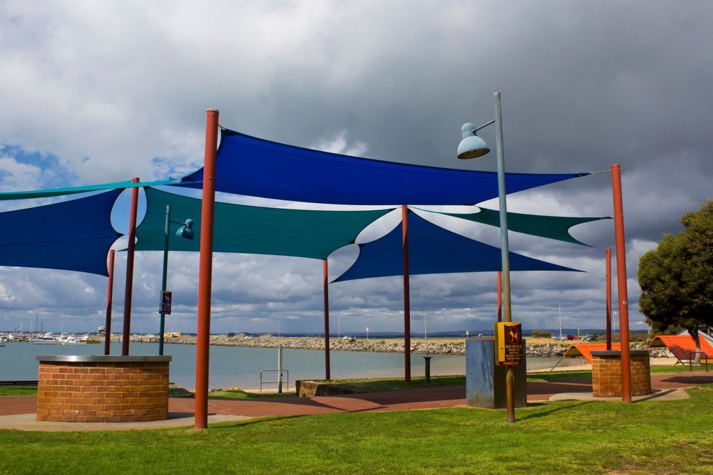 Blue Shade Sails Over Barbecue Area — Shade Sails in Coffs Harbour, NSW