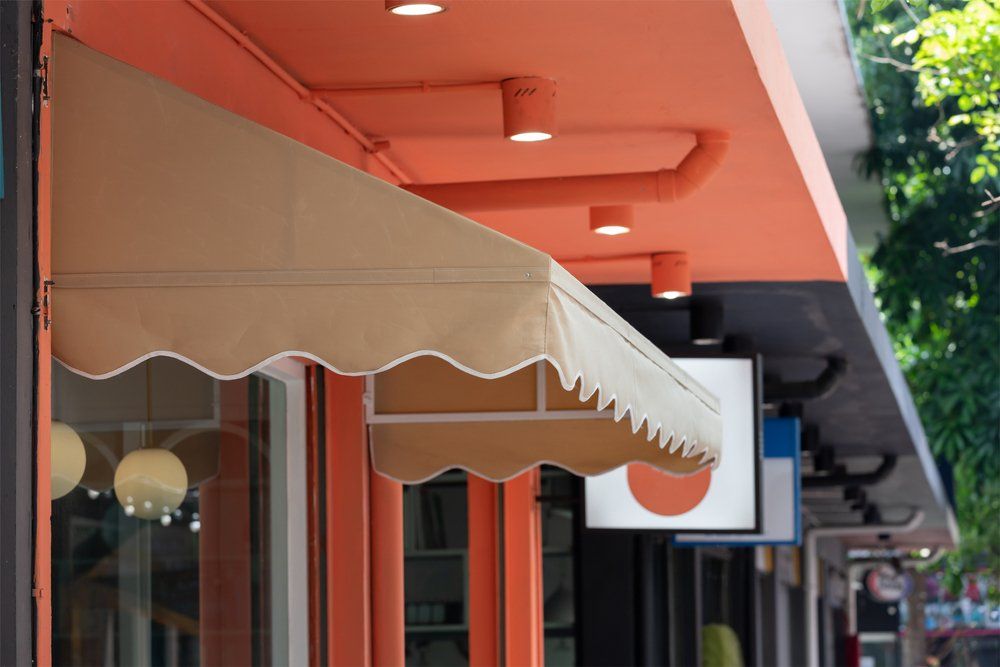 Brown Awning Over Shop — Shade Sails in Coffs Harbour, NSW