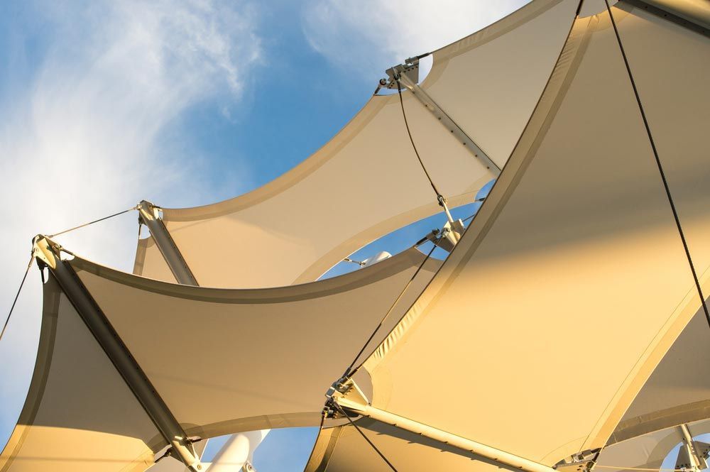 Canopies Anchored To Steel Structures Provide Shade At An Outdoor Pavilion — Shade Sails in Lismore, NSW