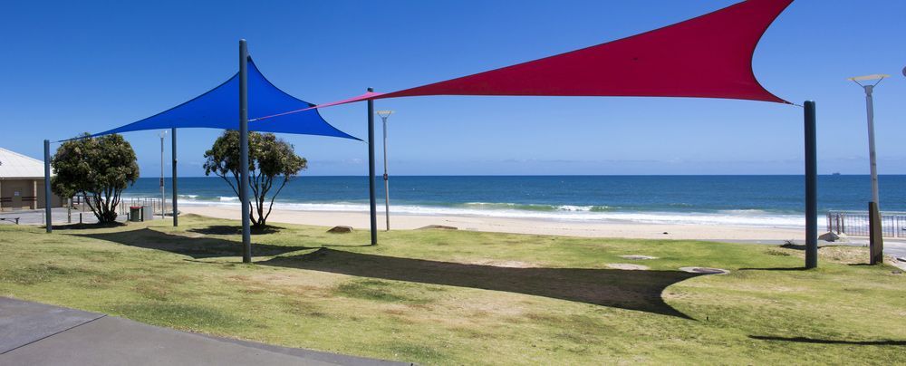Colorful bright Red And Blue Shade Sails — Shade Sails in Byron Bay, NSW