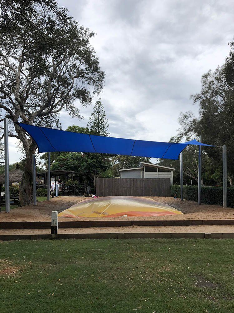 Blue Shade on A Trampoline — Shade Sail Installations in Tweed Heads, NSW