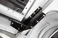 a close up of a metal bracket on the side of a car