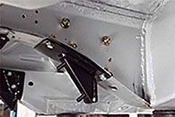 a close up of a metal bracket on a car