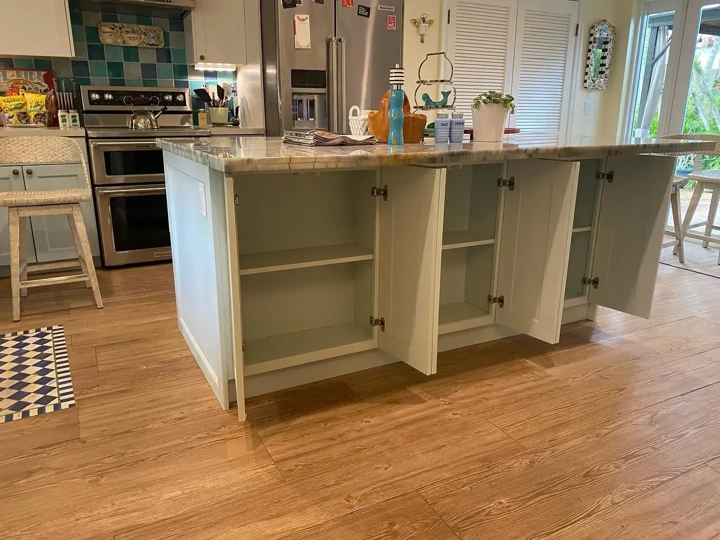 Custom cabinetry and kitchen island in Lighthouse Point, FL by Carpentry Squad