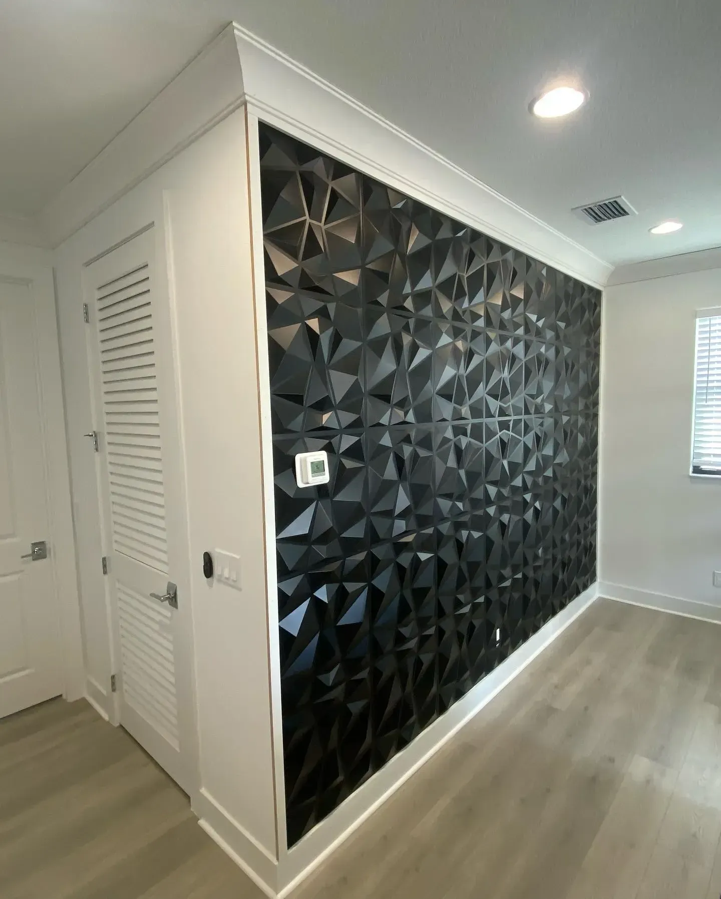 Textured wall with crown molding in Lighthouse Point, FL by Carpentry Squad