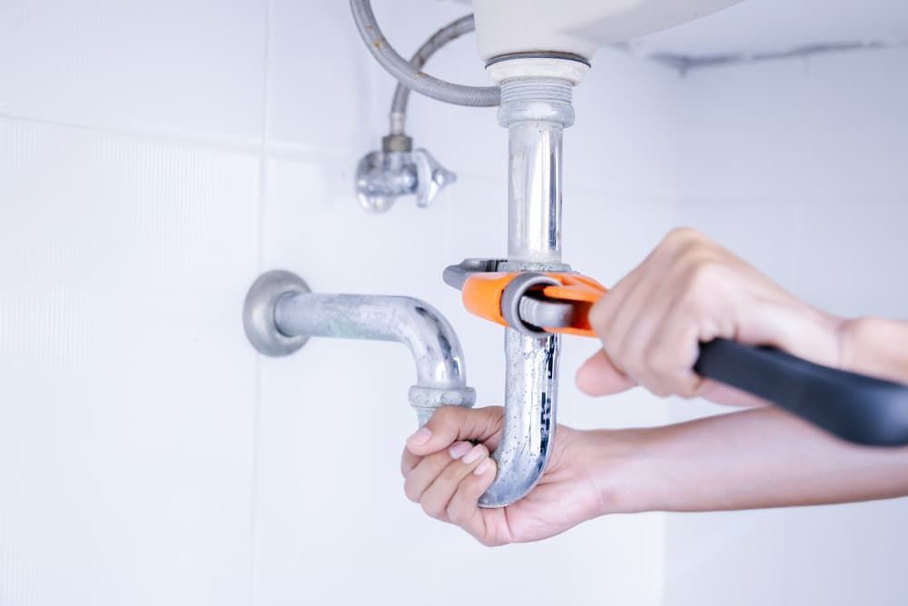 plumber-working-bathroom-plumbing-repair