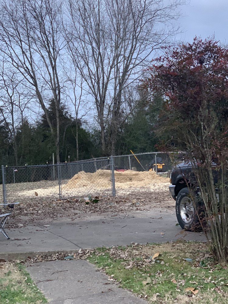 A truck is parked in front of a construction site.