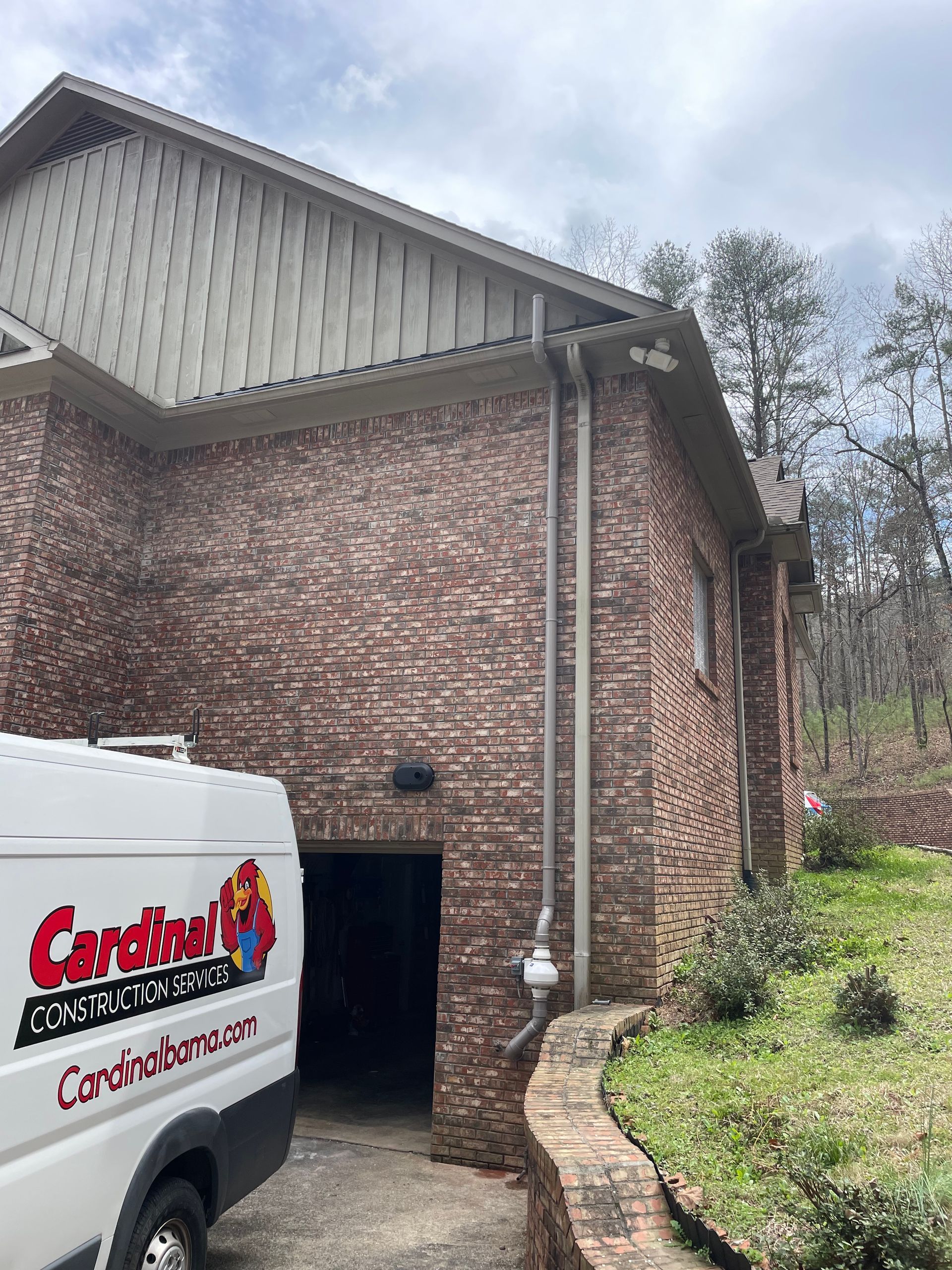 A White Van Is Parked in Front of A Brick House | Birmingham, AL | Cardinal Construction