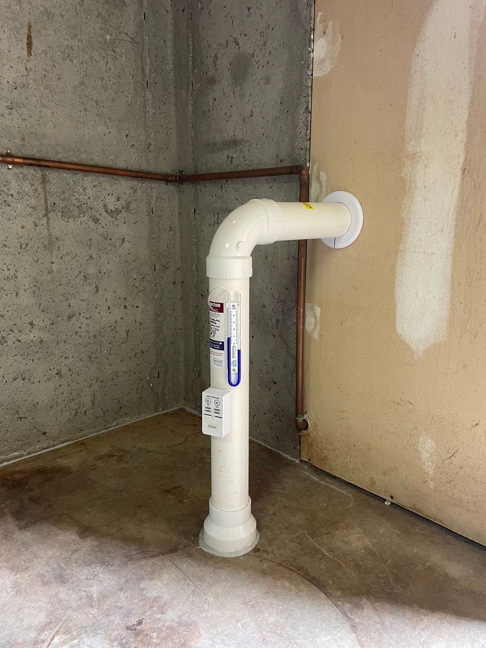 A White Pipe Is Sitting in A Room Next to A Wall | Birmingham, AL | Cardinal Construction