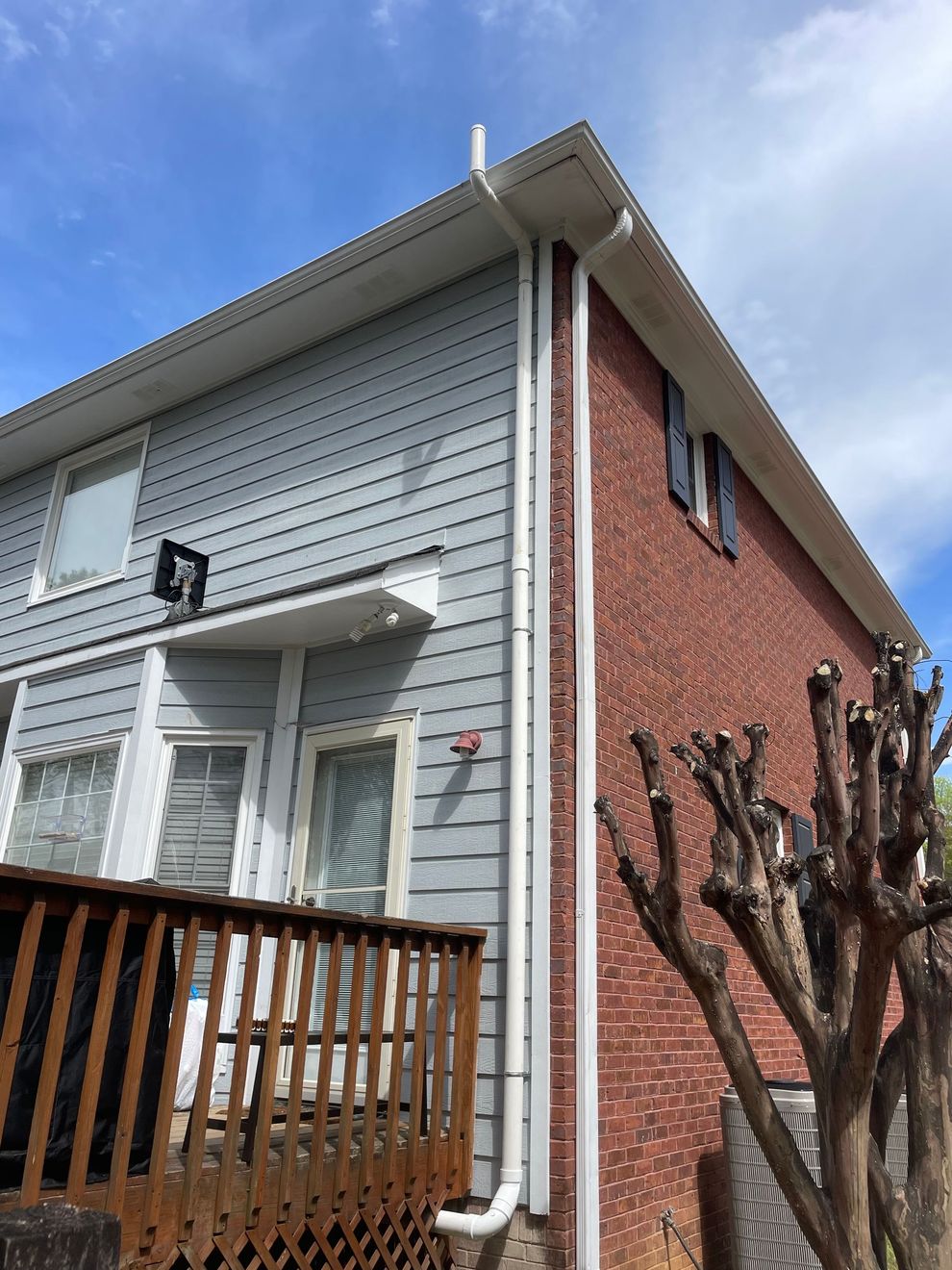 A Brick House with A Gray Siding and A White Gutter | Birmingham, AL | Cardinal Construction