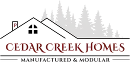 Logo for Cedar Creek Homes with a house, trees, and text 