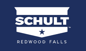 Logo for Schult Homes, white text on a blue shield background. Text includes 