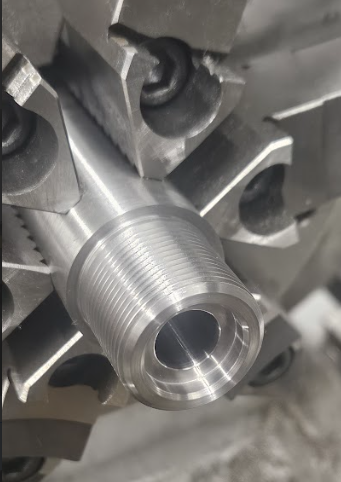 A close up of a metal object with a hole in it