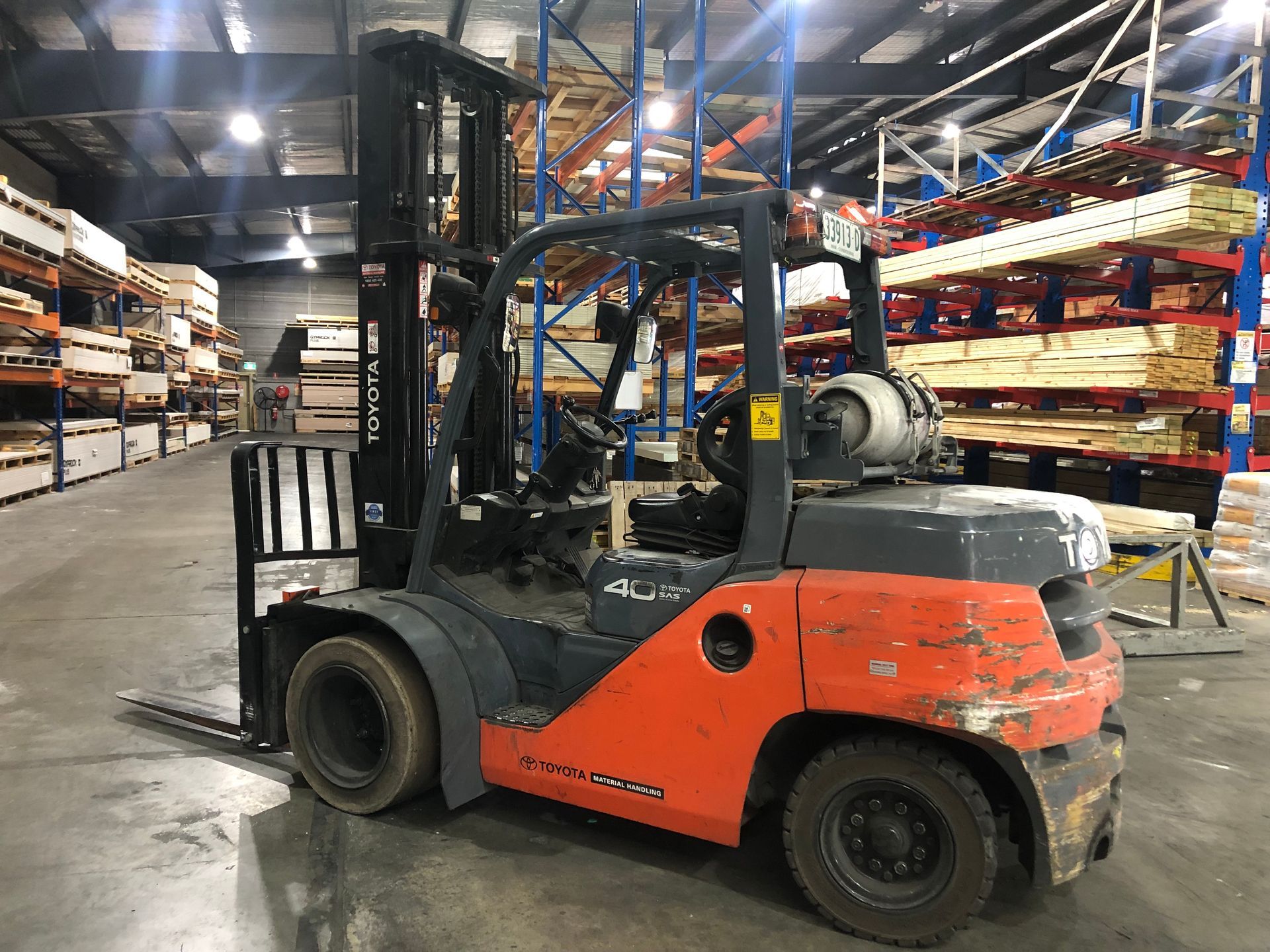 An older red forklift in a warehouse— AAA Equipment Pty Ltd In Port Macquarie, NSW