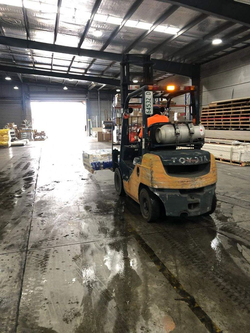 An older forklift for sale in a Warehouse — AAA Equipment Pty Ltd In Redbank, NSW