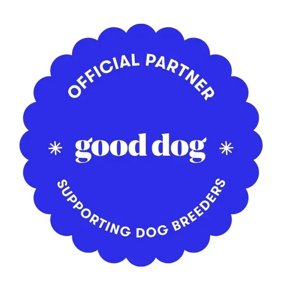 A blue badge that says good dog supporting dog breeders