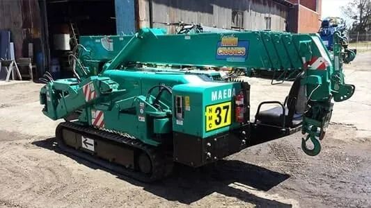 A Green Crane is Parked on the Side of the Road — Newcastle Cranes In Cardiff, NSW