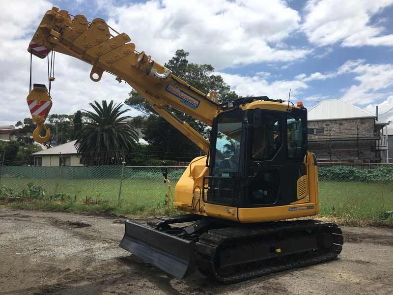 A Yellow Crane is Parked on the Side of the Road — Newcastle Cranes In Cardiff, NSW