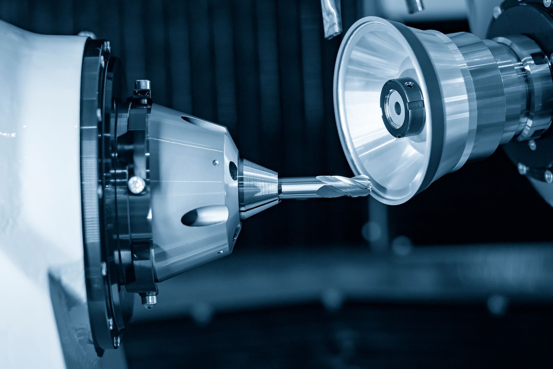 A machine is cutting a piece of metal in a factory.