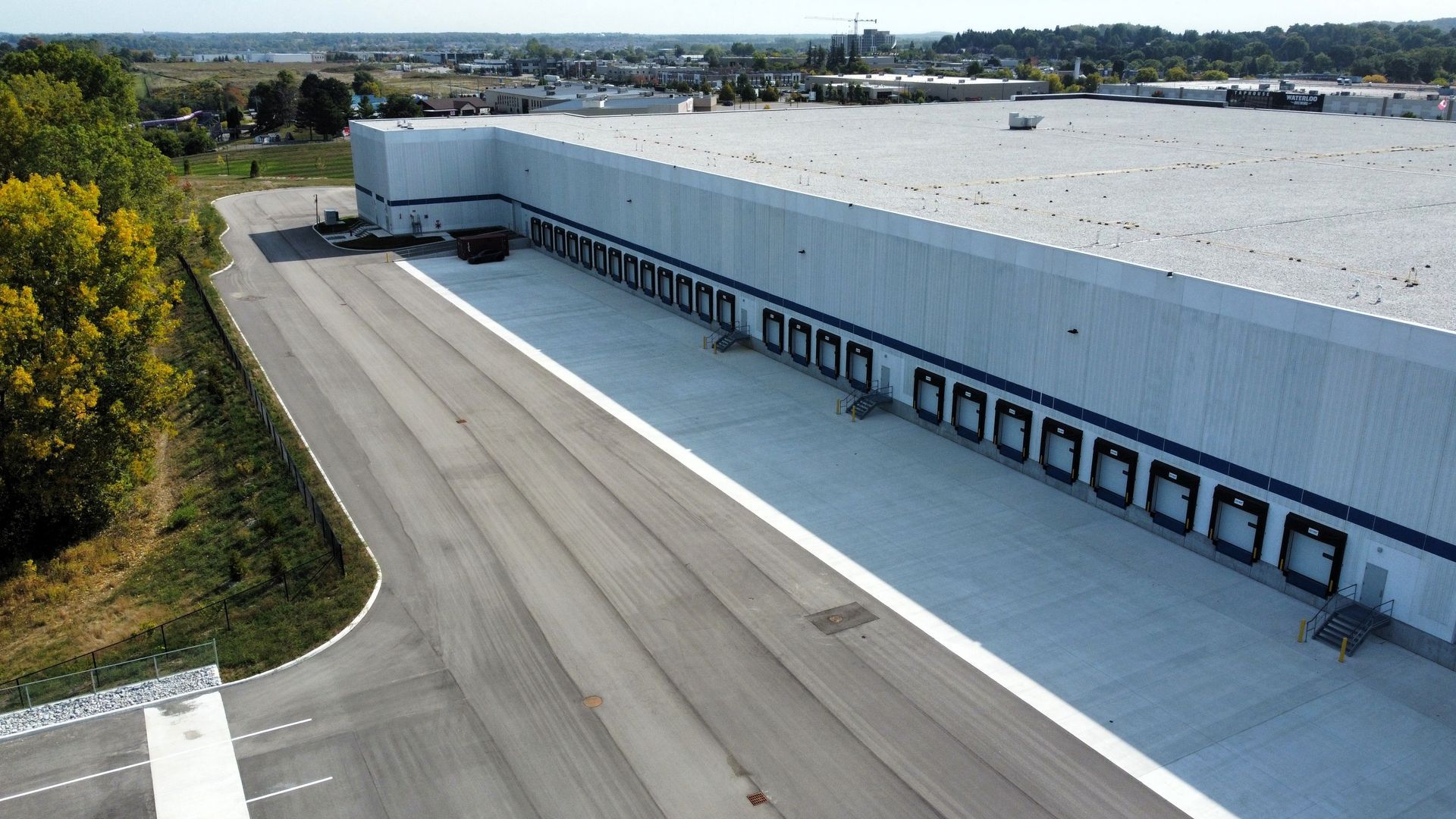 An aerial view of a large warehouse with a lot of loading docks.