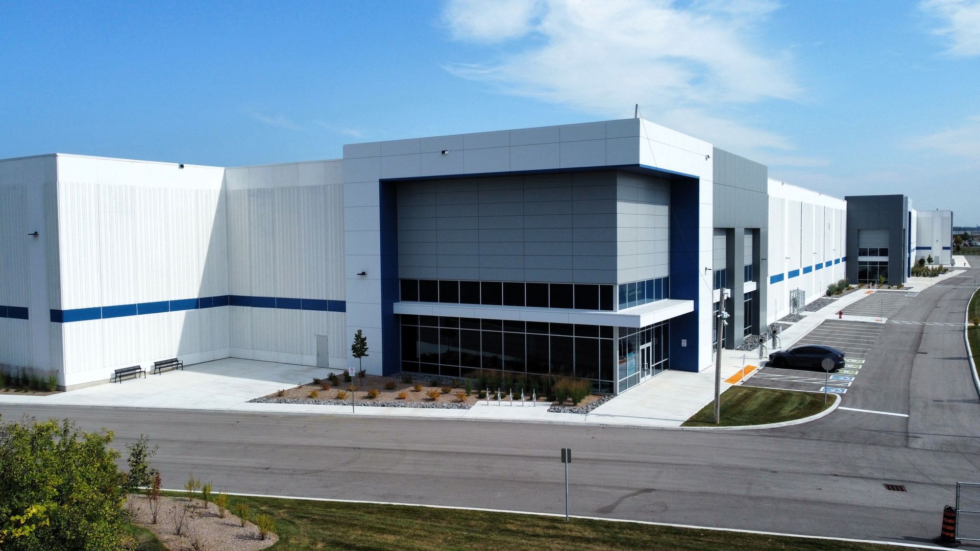 A large white and blue building with a lot of windows