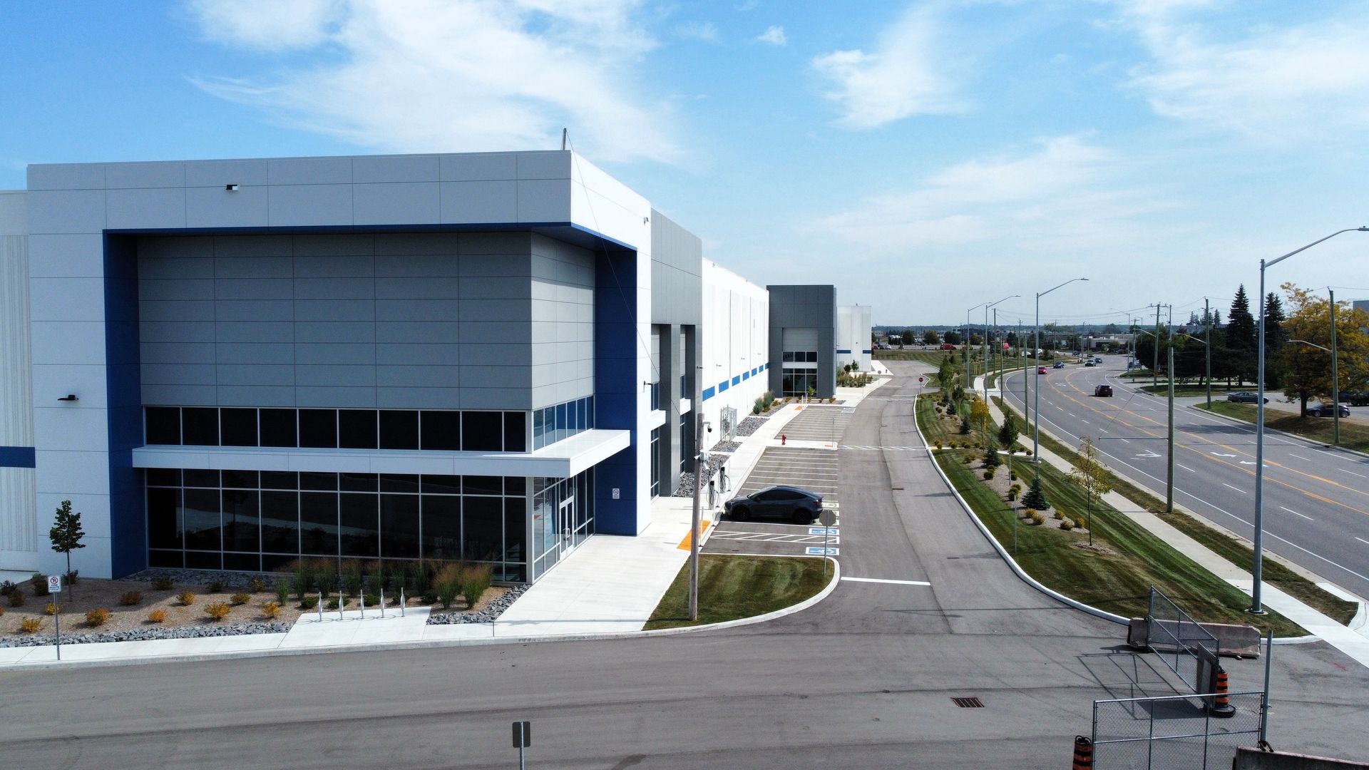 An aerial view of a building next to a road
