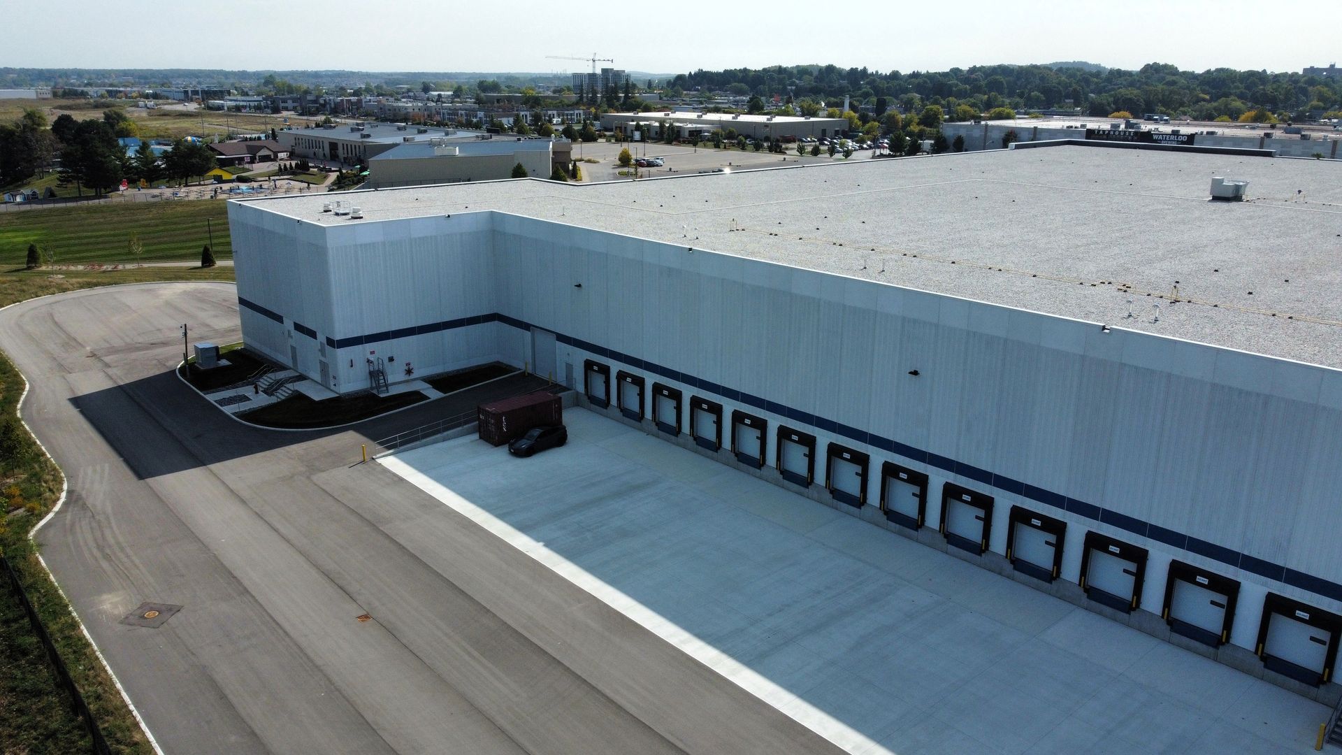 An aerial view of a large warehouse with a lot of loading docks.