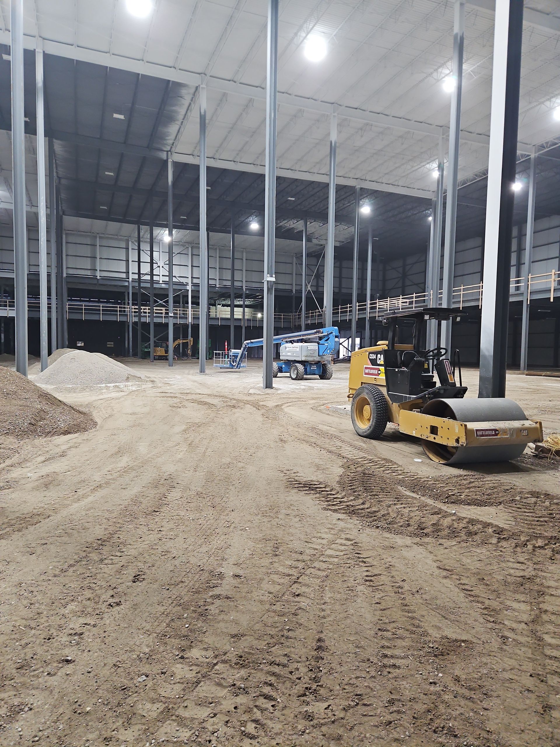 A large warehouse with a roller in the middle of it.