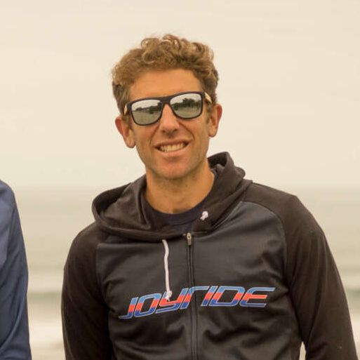 Marc Prutton | A man wearing sunglasses and a jacket that says joyride