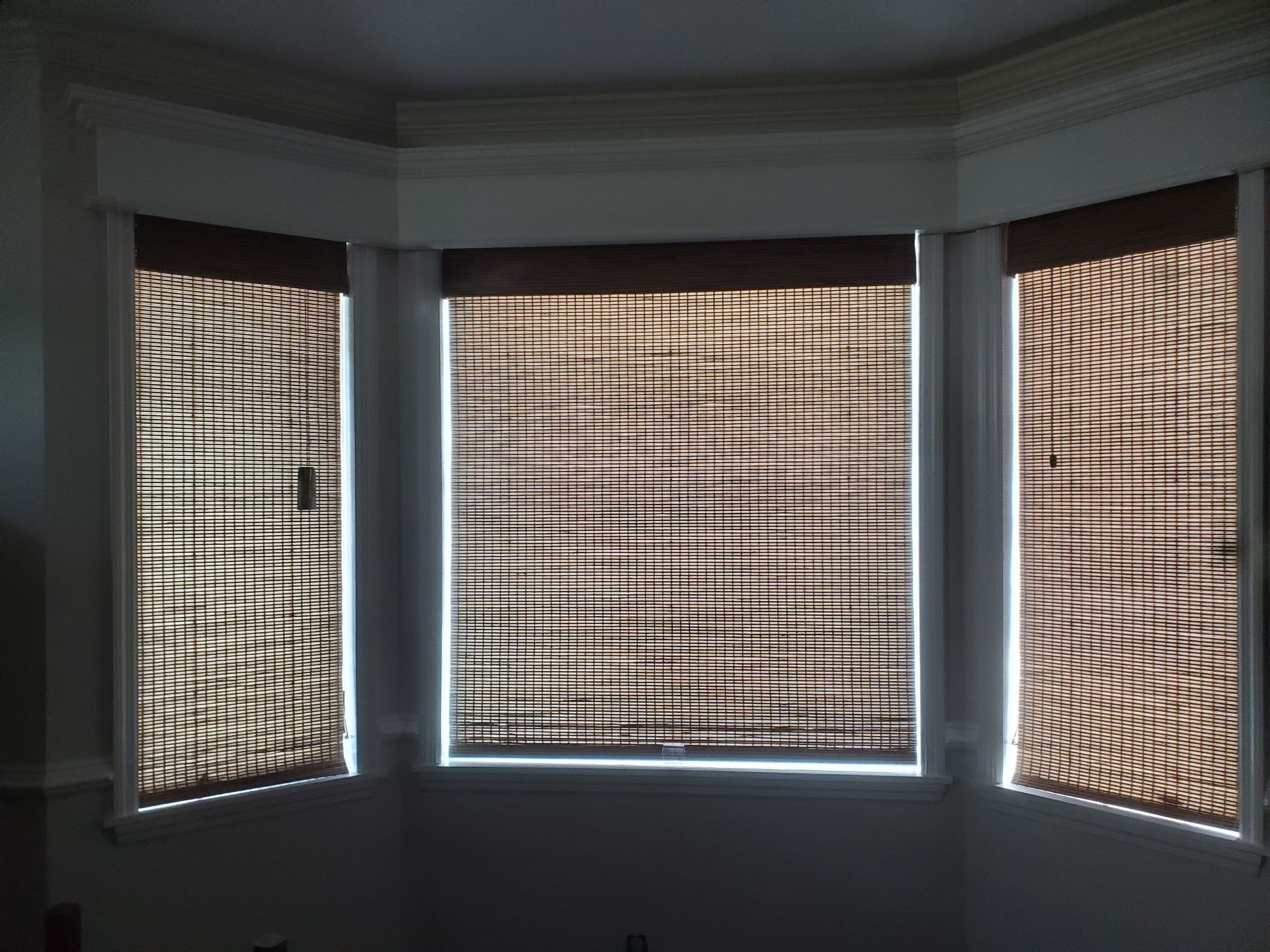 A bay window with wicker blinds on it  — East Peoria, IL — Blinds For Less