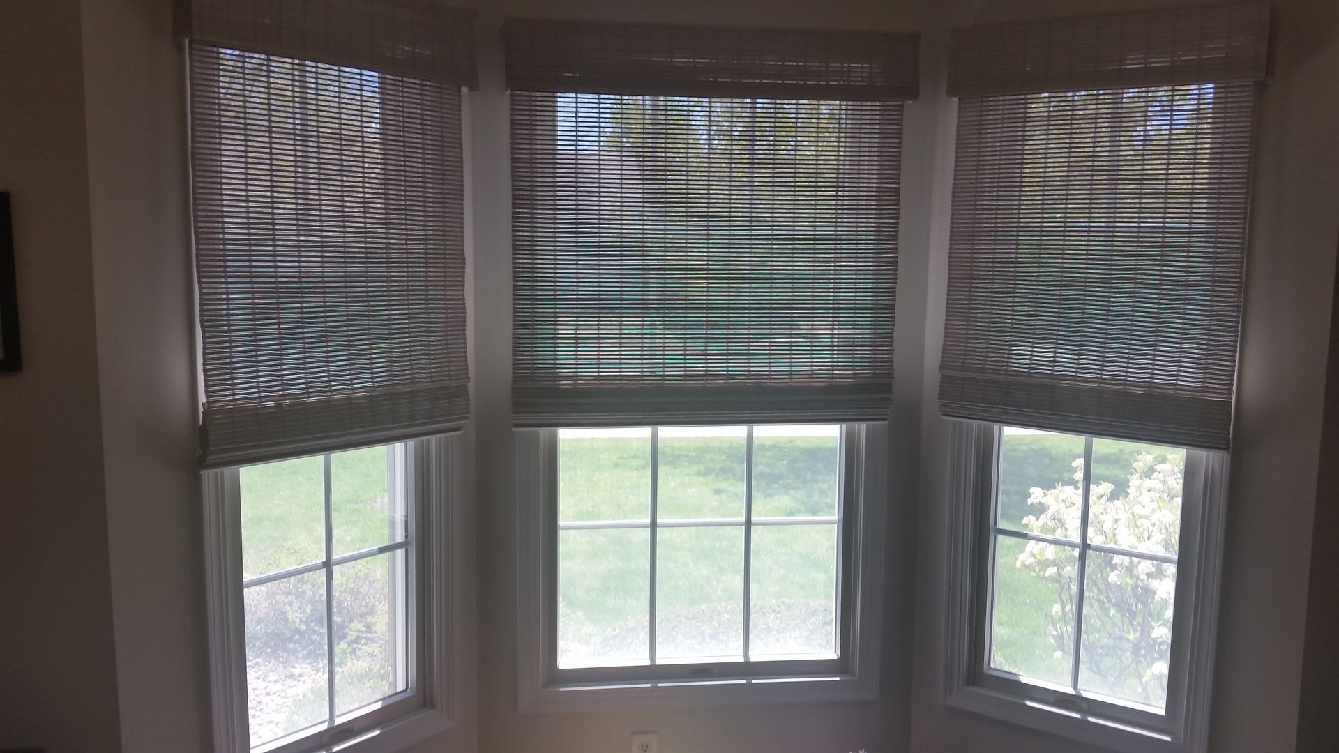 A room with three windows and blinds on them  — East Peoria, IL — Blinds For Less