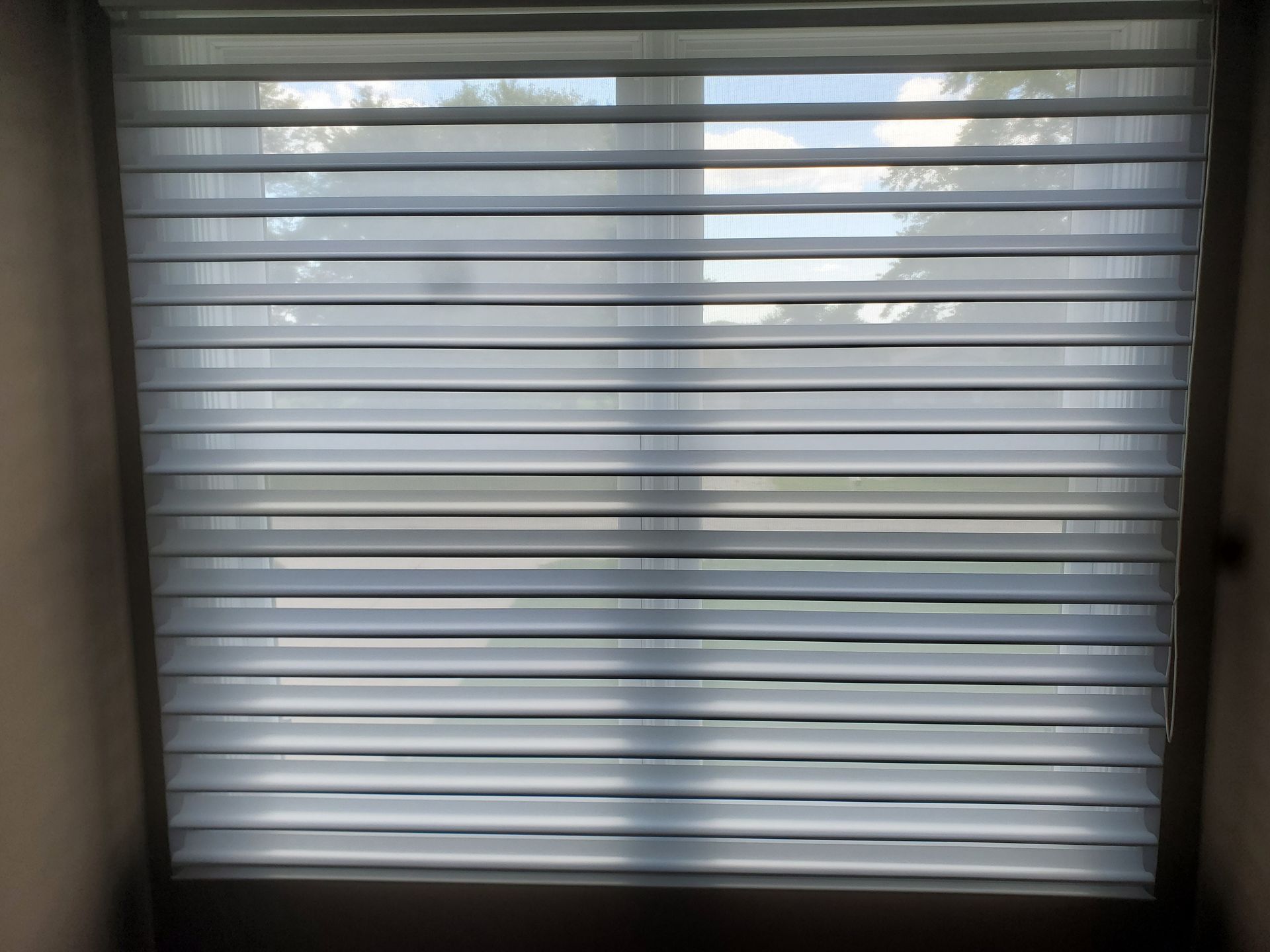 A close up of a window with blinds on it  — East Peoria, IL — Blinds For Less
