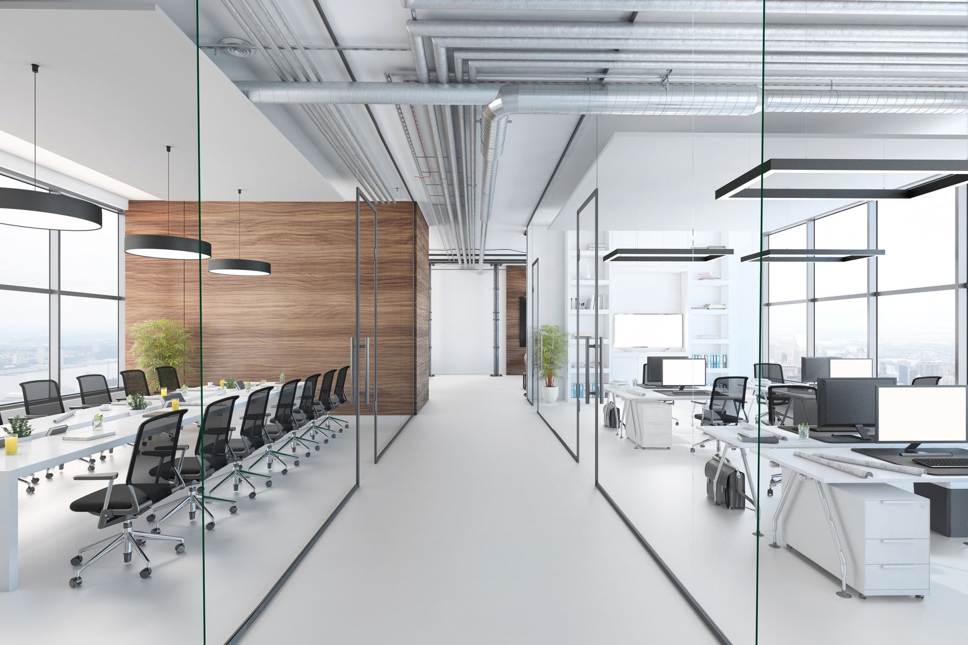A modern office with a glass wall and a conference room.