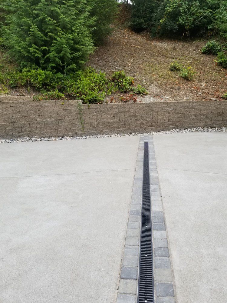 There is a drain in the middle of the driveway.