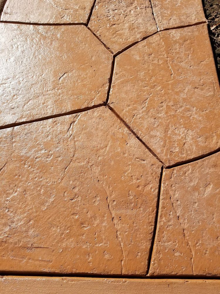 A close up of a concrete floor with a geometric pattern