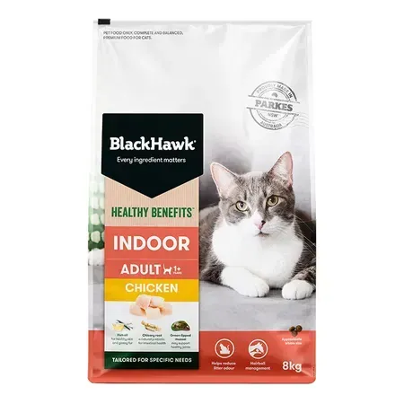 A bag of Black Hawk Indoor Adult cat food with a cat on the packaging. The bag is white with a green, black, and orange label.