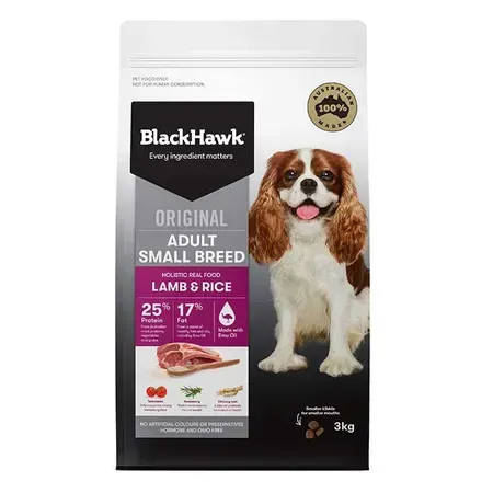 A bag of Black Hawk Original Adult Small Breed Lamb & Rice dog food. The packaging shows a Cavalier King Charles Spaniel.