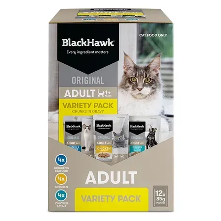 BlackHawk Original Adult cat food variety pack in a cardboard box, featuring a Maine Coon cat. The box has different flavors.