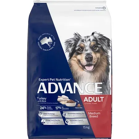 A bag of Advance dog food for adult medium-sized dogs, featuring a photo of a happy Australian Shepherd.